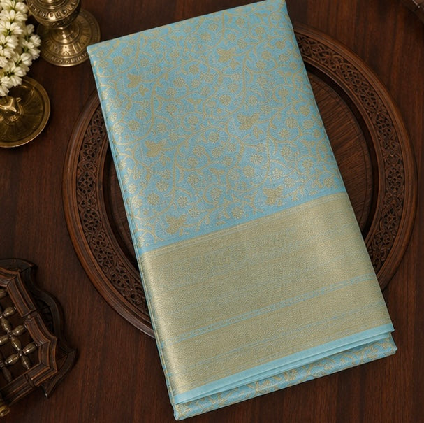 Trisha Mam Inspired Sky Blue & Gold Floral Brocade Soft Silk Saree with Rich Zari Border