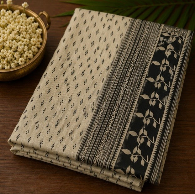 Off White Printed Saree with Black Traditional Border