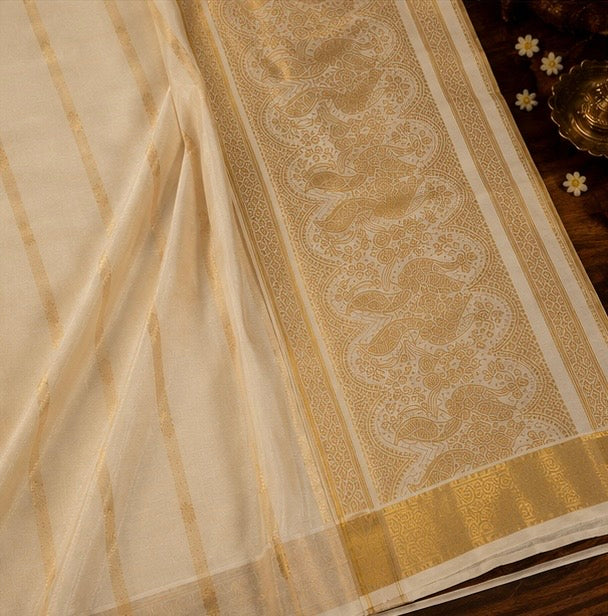 Off White Cotton Saree with Gold Zari Stripes & Traditional Peacock Pallu Design